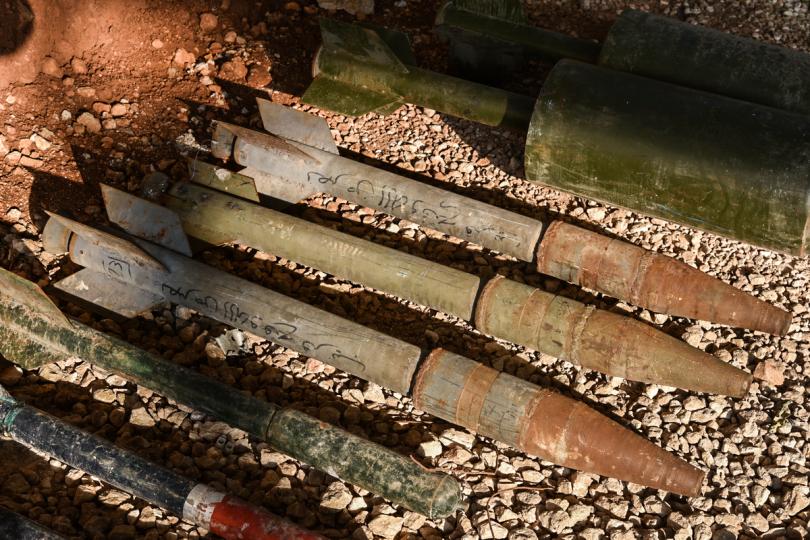 Missiles daubed with Arabic writing are lined up on the ground by Russian troops, who have been backing Syrian government forces in their brutal assaults on rebel-held areas of Aleppo