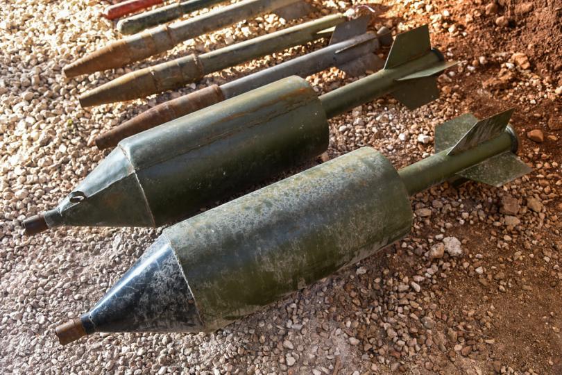 Weapons lie on the dusty ground in Aleppo, the ancient city that has been partially reduced to rubble by Putin’s troops